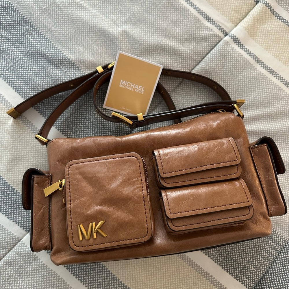 Michael Kors Tan/luggage color with antique gold hardware. Used once.